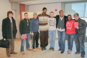 Motivational speaker Stan Pearson (6th in from left) poses with students after his lecture.