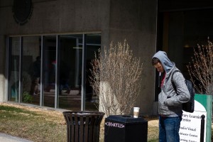 Student smoking outside Marvin Library on HVCC's main campus
