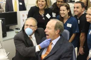 Hudson Valley President. Andrew Matonak gets Dr. Robert Hill II to open wide at the newly refurbished dental clinic in Fitzgibbons Hall.