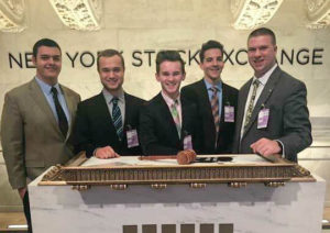 Pictured from left to right: Thomas Nevins, Nathanael Savasta, Max Morand, Ezra Anderson and Kyle Hudson posed for a photo at the New York Stock Exchange on Oct. 27. 